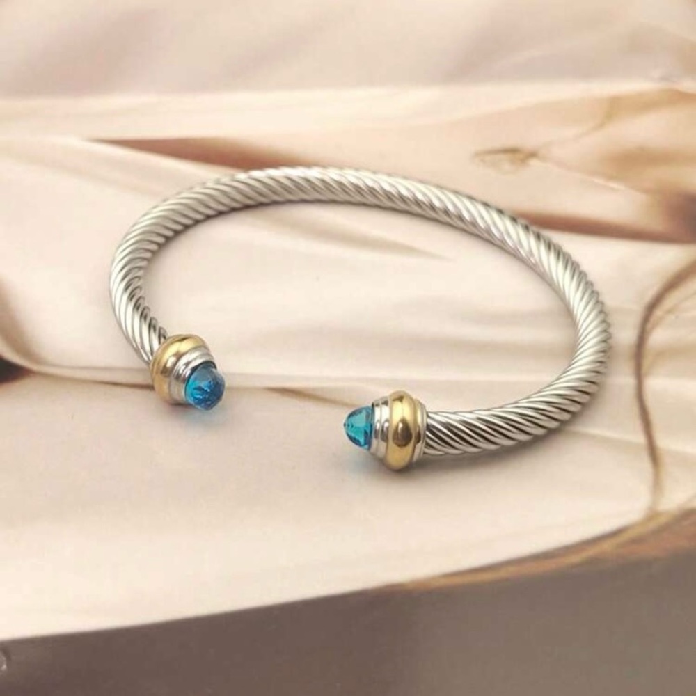 Elegant Silver and Gold Bracelet with Blue Accents